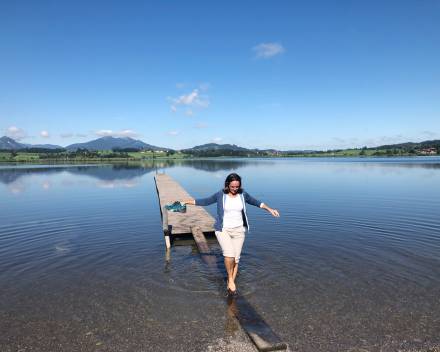 woman on a jetty at hopfensee