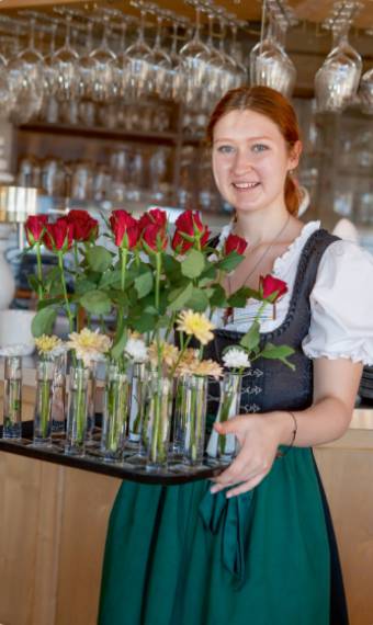 woman with vases and roses