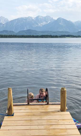 children bathing in lake