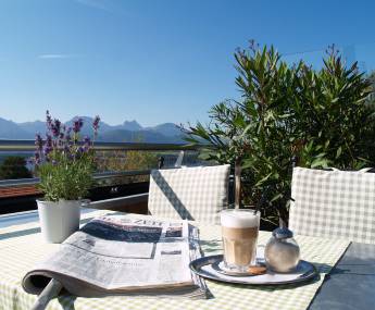 coffee and newspaper at the terrace at spa hotel bavaria