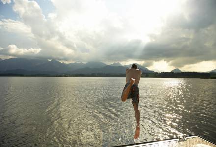 man jump into lake