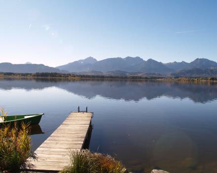 Hopfensee Lake with mountains